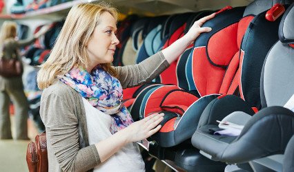 Mother choosing safety seat