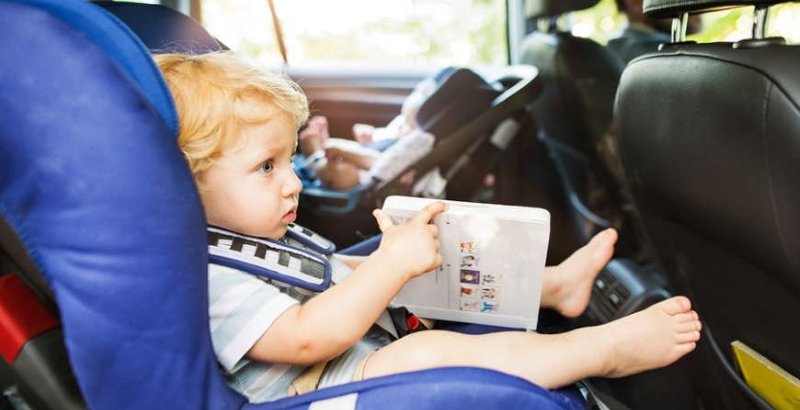 Little children sitting in the car