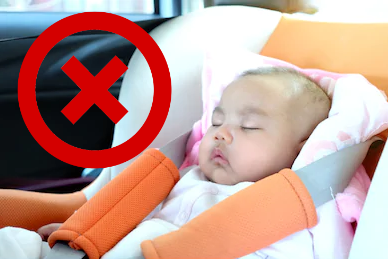 Baby sleeping in car seat with head outlet down